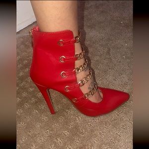 Red heels with gold chains